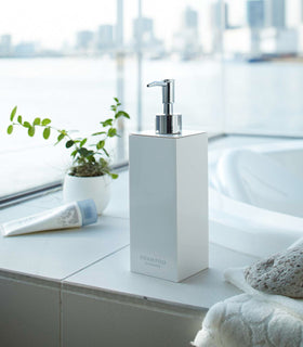 White Yamazaki Home square shampoo dispenser by bathtub view 5