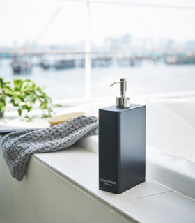 Black Conditioner Dispenser in bathroom by Yamazaki Home. view 17