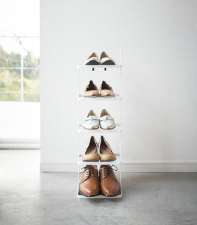 Front view of white entryway Shoe Rack holding shoes by Yamazaki home. view 13