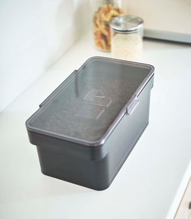 Aerial view of black Airtight Food Storage Container closed on countertop by Yamazaki Home. view 9