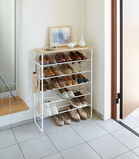 Entryway white Shoe Rack holding shoes by Yamazaki home. view 3