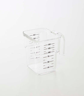 Clear measuring cup on white background by Yamazaki Home. view 27