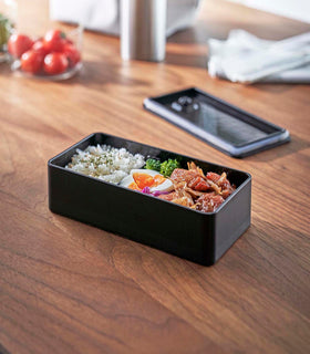 Black Vacuum-Sealing Bento Box holding food by Yamazaki Home. view 22