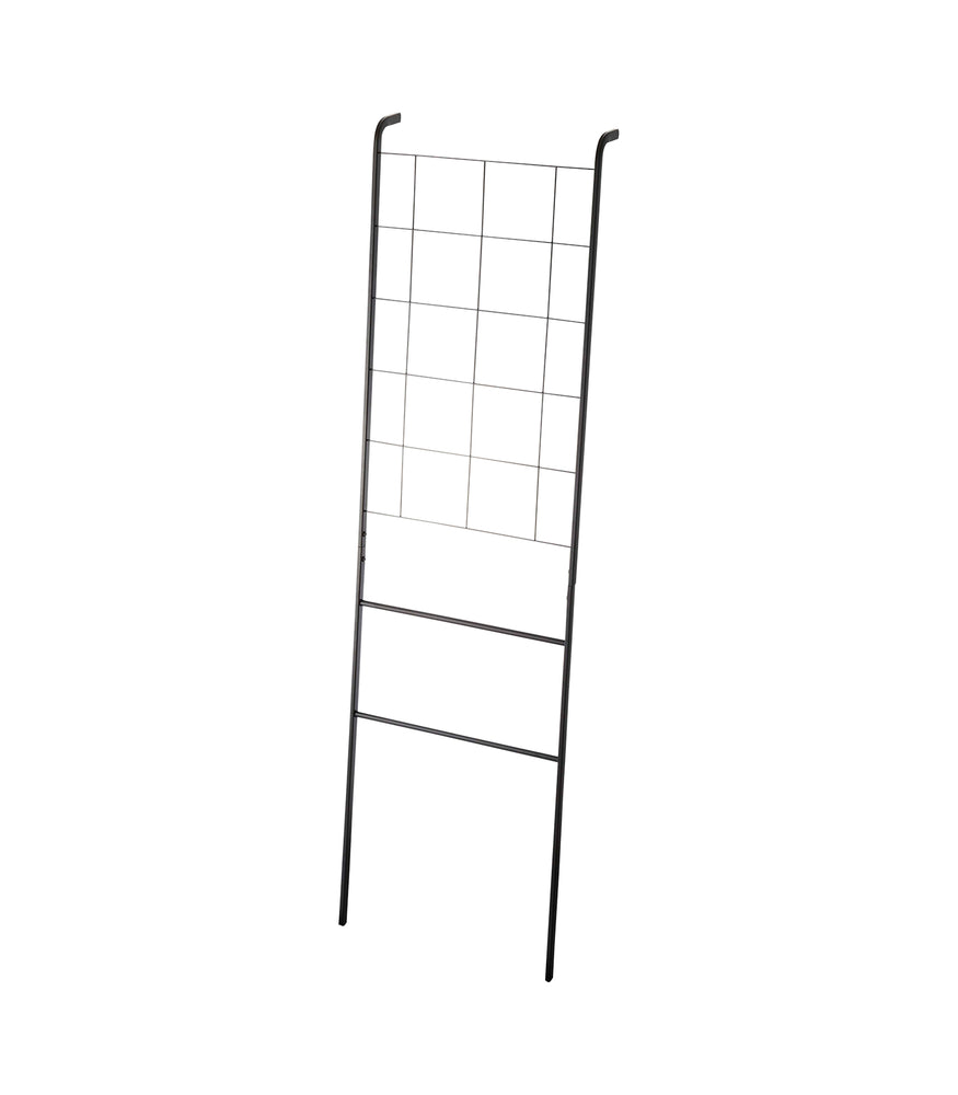 View 7 - Leaning Ladder with Grid Panel on a blank background.