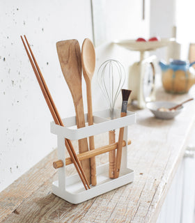 Utensil Holder displaying kitchen cooking utensils on shelf by Yamazaki Home. view 3