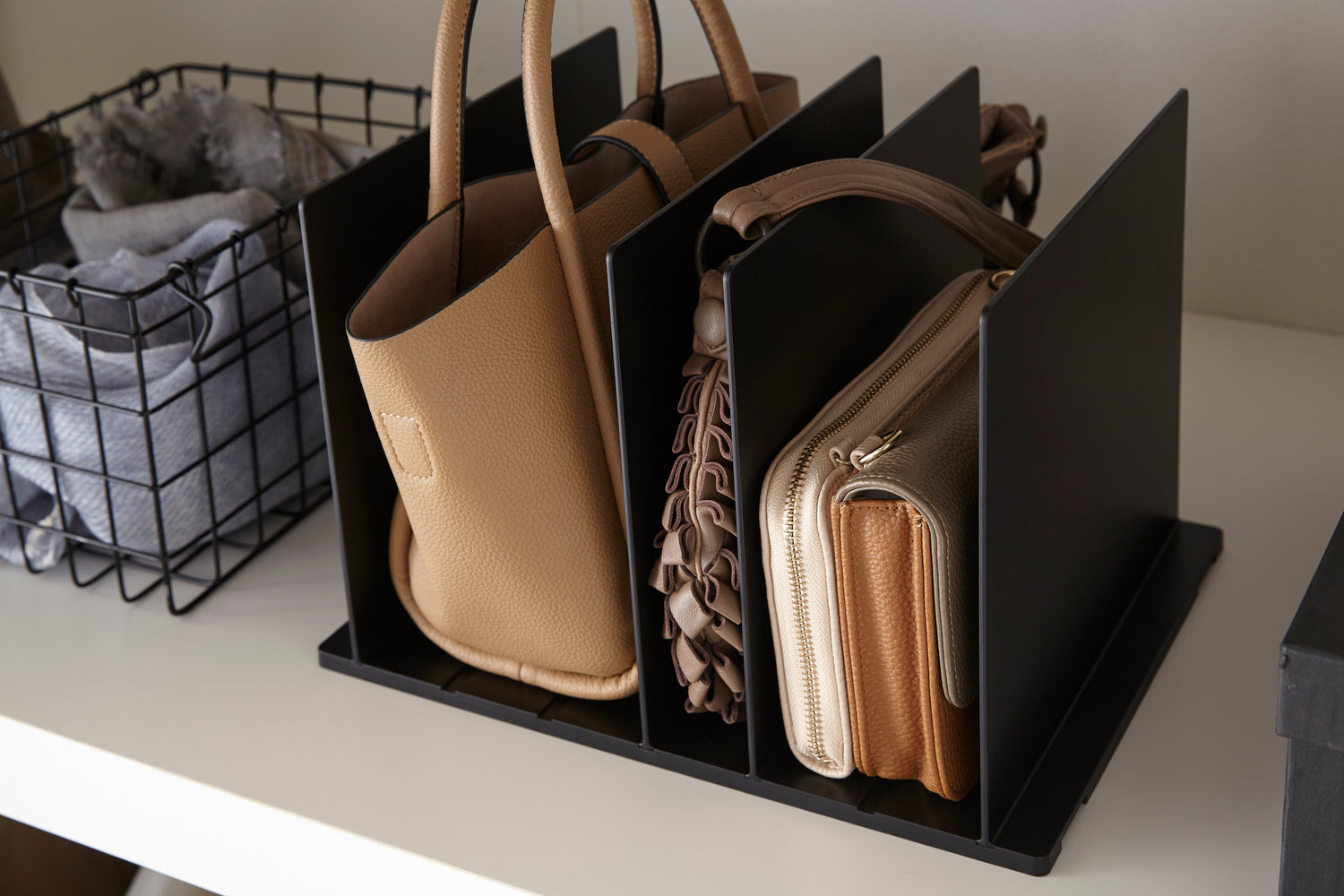 View 9 - Black Bag Organizer with Customizable Dividers holding purses by Yamazaki Home.