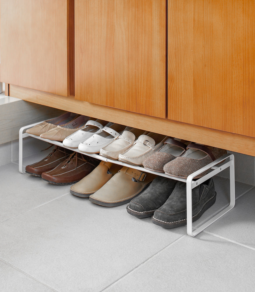 View 4 - White Stackable Shoe Rack in bedroom by Yamazaki Home.