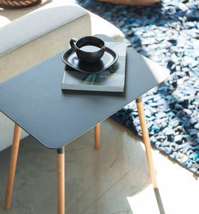 Aerial view of black Side Table holding cup and book by Yamazaki Home. view 9
