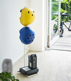 White Kids' Helmet Stand holding air equipment and helmets by Yamazaki Home. view 3