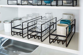 Close up of 3 Yamazaki Home black Glass and Mug Cabinet Organizers on a shelf view 12
