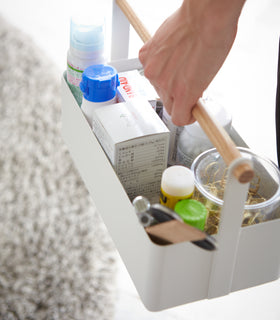 Aerial view of white Storage Caddy holding first-aid items by Yamazaki Home. view 5