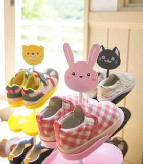 Close up of pink Kids' Shoe Rack by Yamazaki Home. view 3