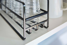 Close up of the grating of a Yamazaki Home black Glass and Mug Cabinet Organizer view 13