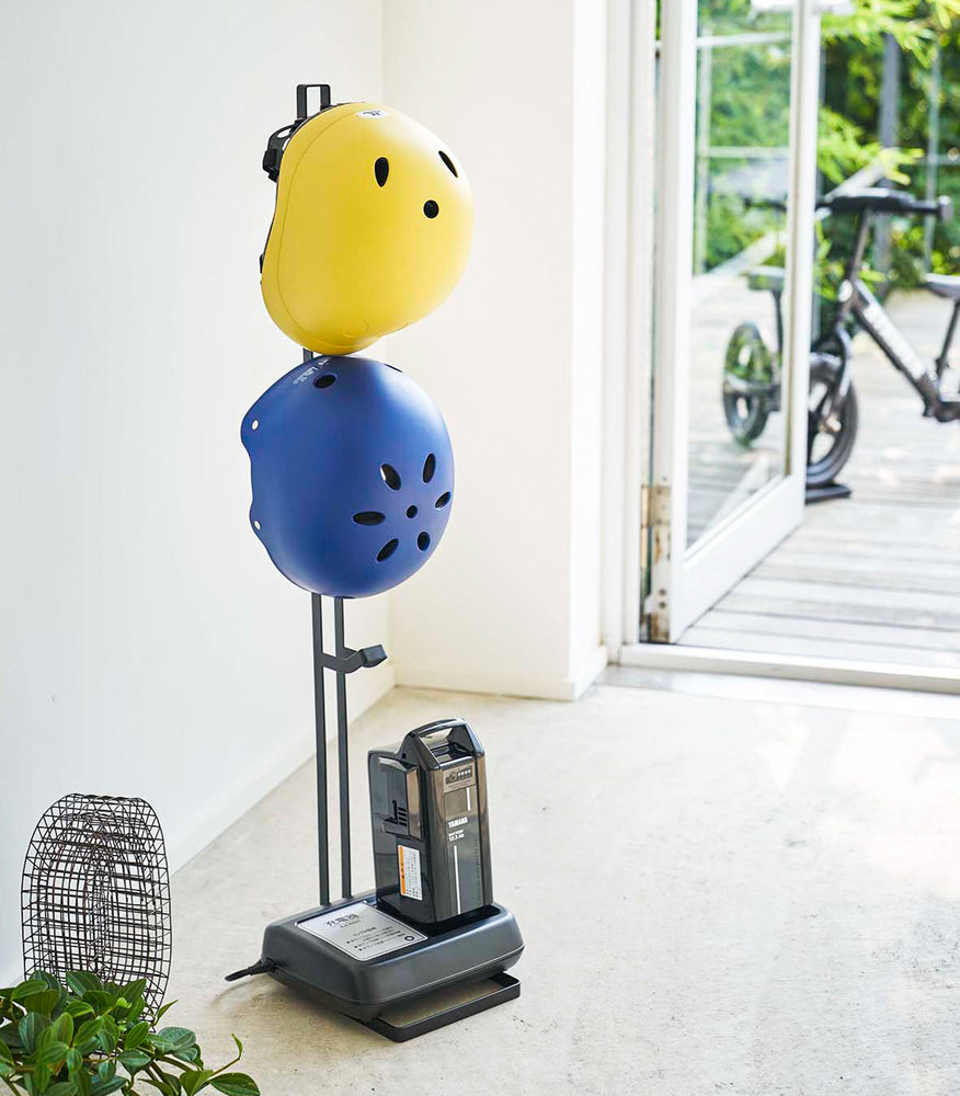 View 7 - Black Kids' Helmet Stand holding helmets and bike gear by Yamazaki Home.