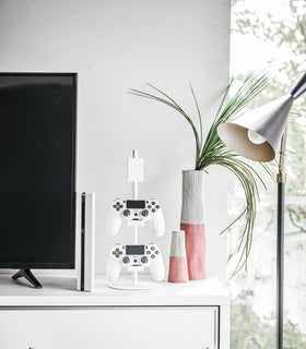 Front view of white Controller Stand displaying game controllers by Yamazaki Home. view 3