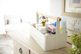 Side view of white Storage Caddy holding first-aid items by Yamazaki Home. view 6