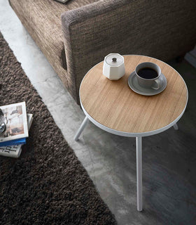 View of White Side Table by Yamazaki Home from the top, with a cup of coffee and sugar canister. view 6