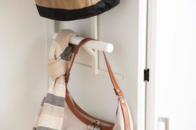 Close up bottom view of White Kids' Backpack Hanger holding a scarf, purse, and backpack by Yamazaki Home. view 5