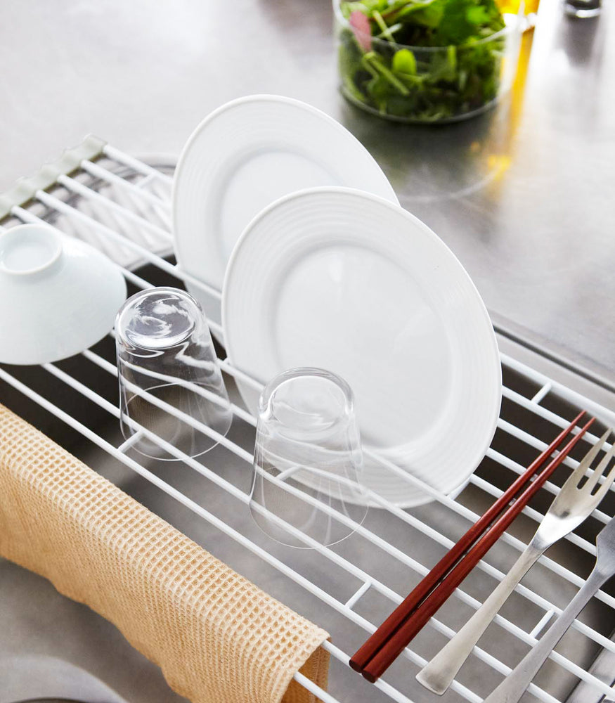 View 3 - Aerial view of Over-the-Sink Dish Drainer holding dishware by Yamazaki Home.