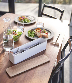 White Utensil Case holding utensils on dining table by Yamazaki Home. view 4