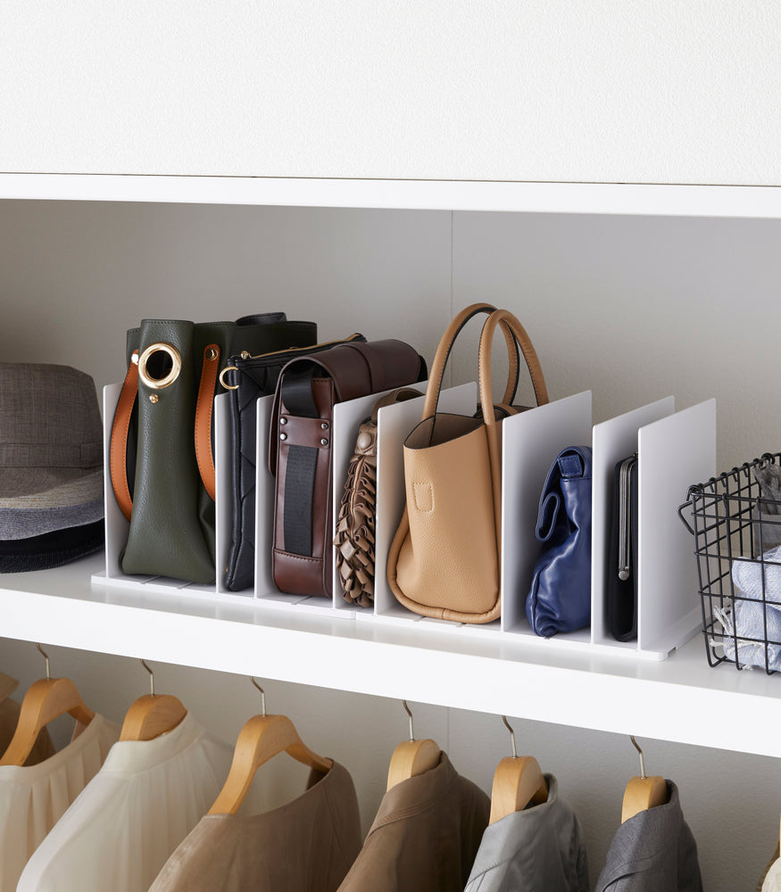 View 2 - White Bag Organizer with Customizable Dividers displaying bags in closet by Yamazaki Home.