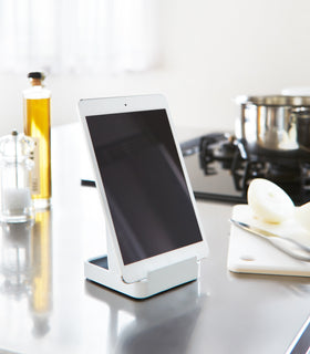 White Lid & Ladle Stand displaying tablet on kitchen countertop by Yamazaki Home. view 5