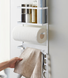 Front view of Magnetic Organizer in kitchen holding towels and spices by Yamazaki home. view 6