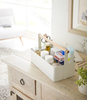 White Storage Caddy containing first-aid items by by Yamazaki Home. view 3