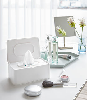 Open white Wet Wipe Case holding wet wipes on vanity by Yamazaki Home. view 3