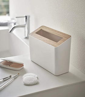 White Countertop Waste Bin on bathroom sink countertop by Yamazaki Home. view 2