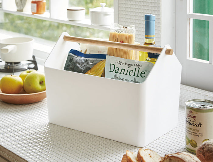 Favori Caddy from Yamazaki Home filled with dry goods, Oyster Bay wine, and other materials for a delicious dinner. Prepare for the New Year with Osoji. Caddy set on a modern kitchen counter.