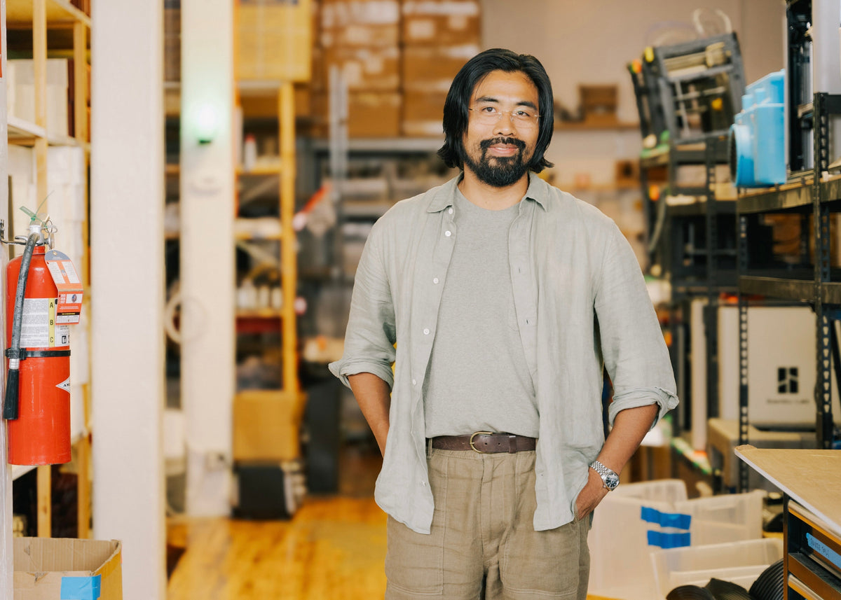 Sean Kim, the founder of Wooj stand in his studio for the Yamazaki Home Artist Spotlight.
