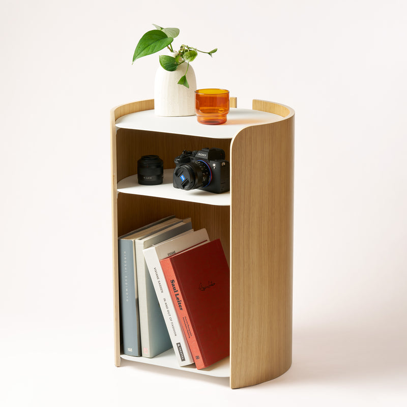 Contour Side Table - Steel + Wood in White with various props against a white background