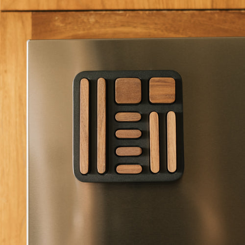 Wooden block magnet set on a metallic surface