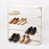 White steel obround shoe rack with four shelves holding 6 pairs of shoes and entryway table.