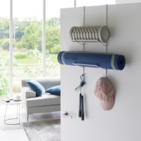 Yamazaki Home over the door hanger gym organizer on a white door. 