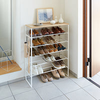 Yamazaki Home 6 tier shoe rack holding shoes in entryway 