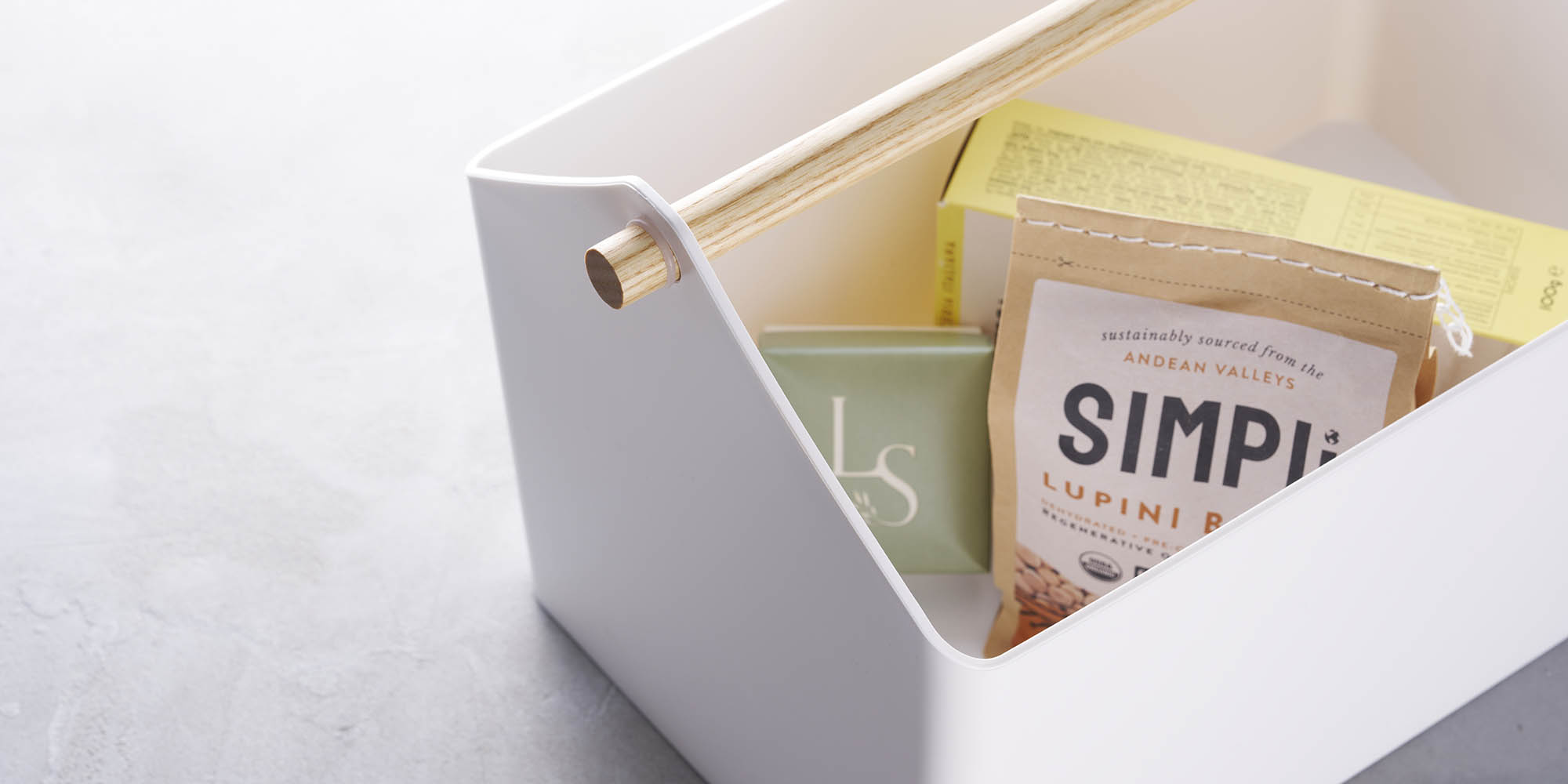 Storage caddy holding snacks and crackers