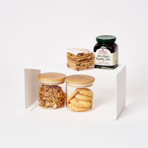 Yamazaki Home White Large Stackable Countertop Shelf - Two Sizes with props, set against a white background.