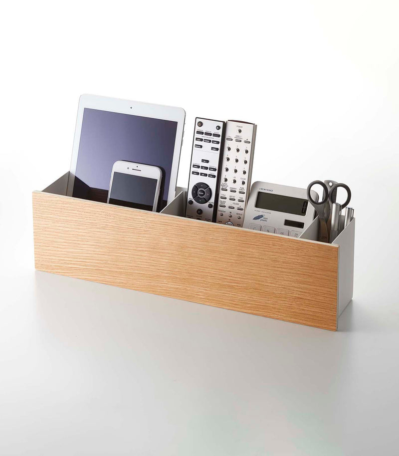 Yamazaki Home desk organizer in large holding a tablet, a phone, remote controllers. 