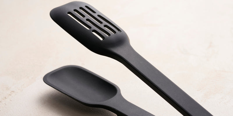 Floating Utensil closeup. Black silicone material. Cover image. 