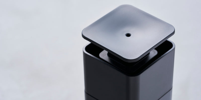 Push Soap Dispenser in Black. Closeup image 