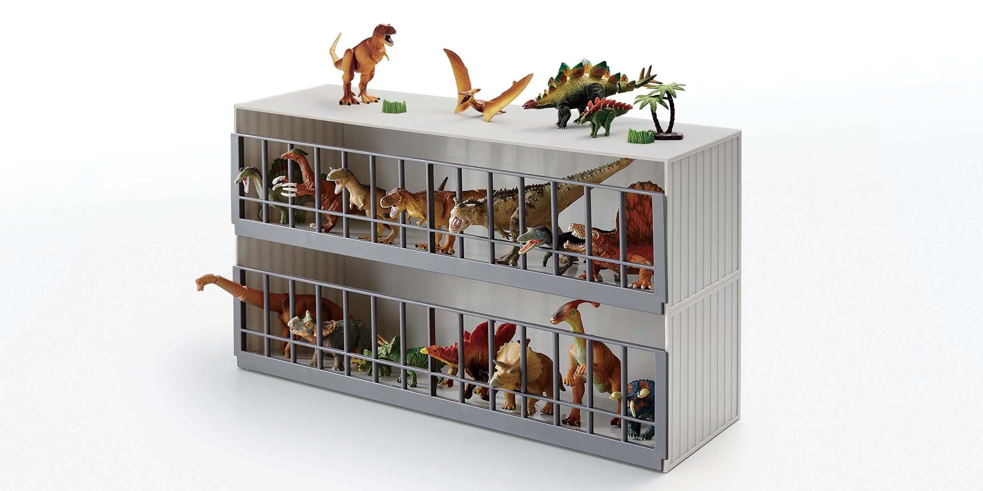 Two-level Toy Display case holding various toy dinosaurs on both levels and the top surface. 