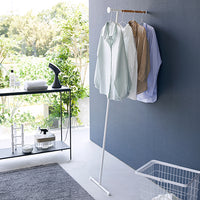 Yamazaki Home leaning coat rack holding four shirts