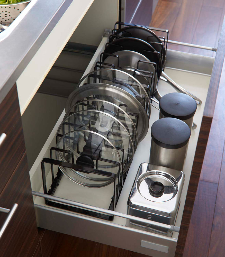 View 7 - Adjustable black steel pot lid and frying pan organizer.
