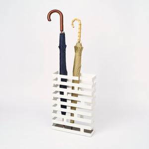 Yamazaki Home Umbrella Stand - Two Styles with props, set against a white background.