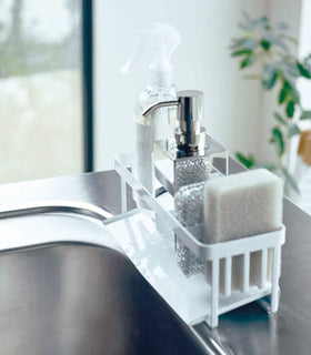 Profile of white steel sponge and soap bottle holder with white draining tray. view 7