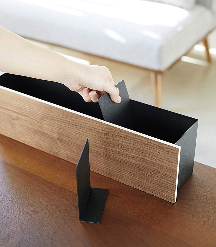 View 22 - Black Desk Organizer with dividers being inserted by Yamazaki Home.