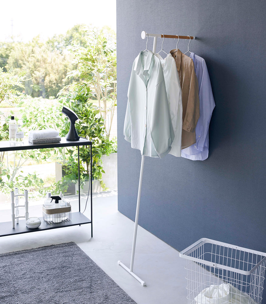 View 2 - White Yamazaki Home Clothes Steaming Leaning Pole Hanger with clothes