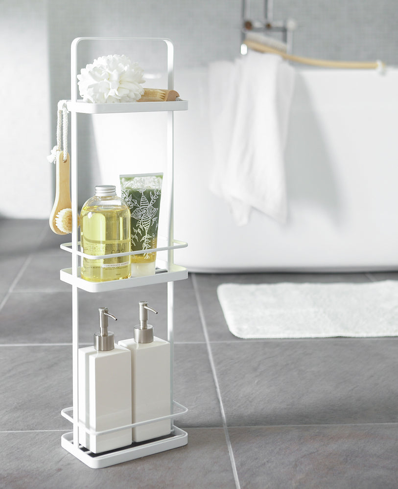 View 17 - White Portable Shower Caddy displaying cleaning products in bathroom by Yamazaki Home.